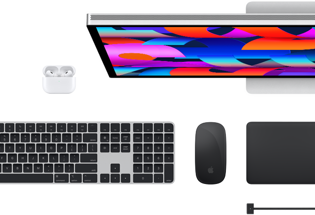 Top view of select Mac accessories: Studio Display, Magic Keyboard, Magic Mouse, Magic Trackpad, AirPods, and MagSafe charging cable